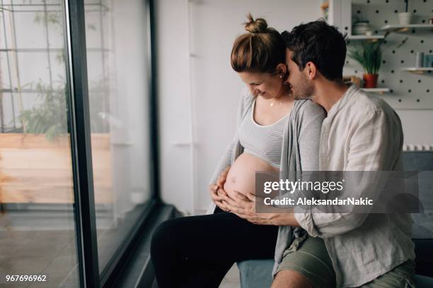 couple expecting a baby - antenatal stock pictures, royalty-free photos & images