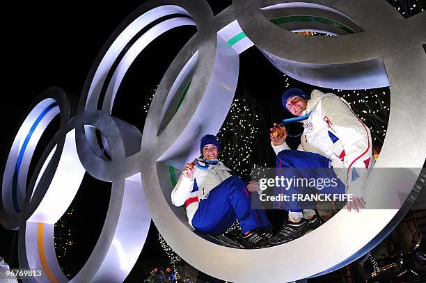 Biathlon French athletes Marie Laure Brunet and Vincent Jay pose with the bronze medals of the Vancouver 2010 Winter Olympics they won earlier in the...