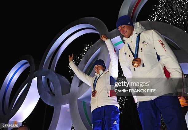 Biathlon French athletes Marie Laure Brunet and Vincent Jay pose with the bronze medals of the Vancouver 2010 Winter Olympics they won earlier in the...