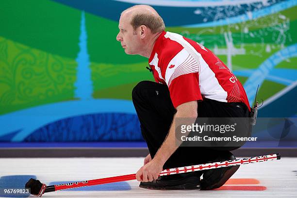 Skip Kevin Martin of Canada looks down the sheet during the men's curling round robin game between Canada and Germany on day 5 of the Vancouver 2010...