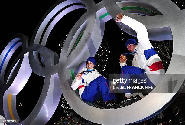 Biathlon French athletes Marie Laure Brunet and Vincent Jay pose with the bronze medals of the Vancouver 2010 Winter Olympics they won earlier in the...