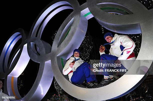 Biathlon French athletes Marie Laure Brunet and Vincent Jay pose with the bronze medals of the Vancouver 2010 Winter Olympics they won earlier in the...