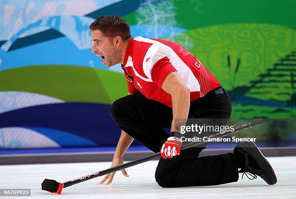 John Morris of Canada directs teammates during the men's curling round robin game bewteen Canada and Germany on day 5 of the Vancouver 2010 Winter...