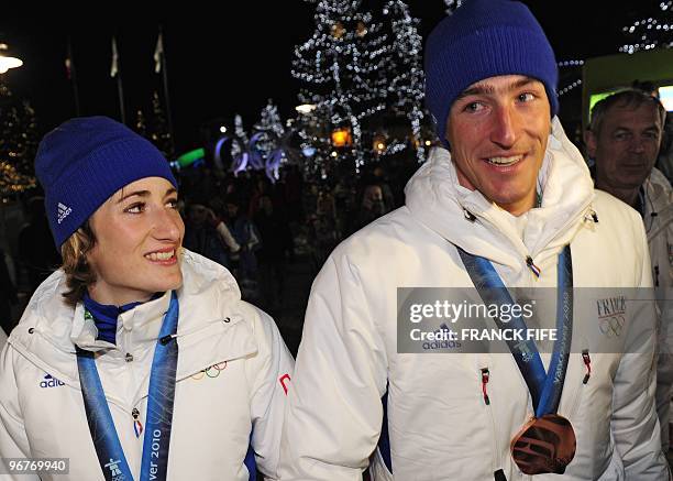 Biathlon French athletes Marie Laure Brunet and Vincent Jay with the bronze medals of the Vancouver 2010 Winter Olympics they won earlier in the day...