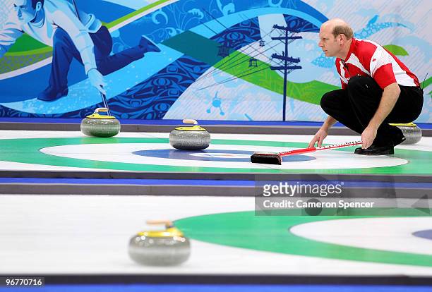 Skip Kevin Martin of Canada looks down the sheet during the men's curling round robin game between Canada and Germany on day 5 of the Vancouver 2010...