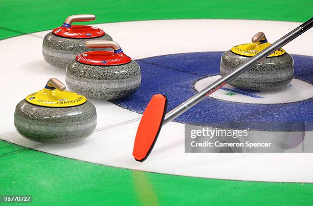 Stones sit on the house during the men's curling round robin game on day 5 of the Vancouver 2010 Winter Olympics at Vancouver Olympic Centre on...