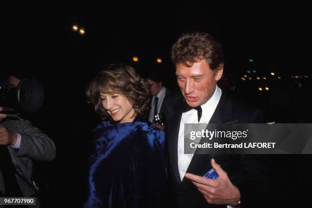 Nathalie Baye et Johnny Hallyday assistent à la première du film 'Le Choix de Sophie' le 28 mars 1983 à Paris, France.