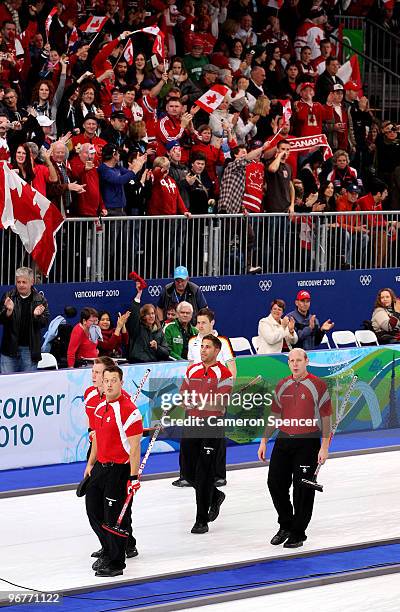 Fans cheer the Canadian men's curling team after winning their round robin game against Germany on day 5 of the Vancouver 2010 Winter Olympics at...