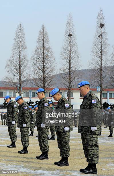 South Korean soldiers pay a silent tribute to victims of Haiti's earthquake during a dispatching ceremony of the South Korean peacekeepers at an army...