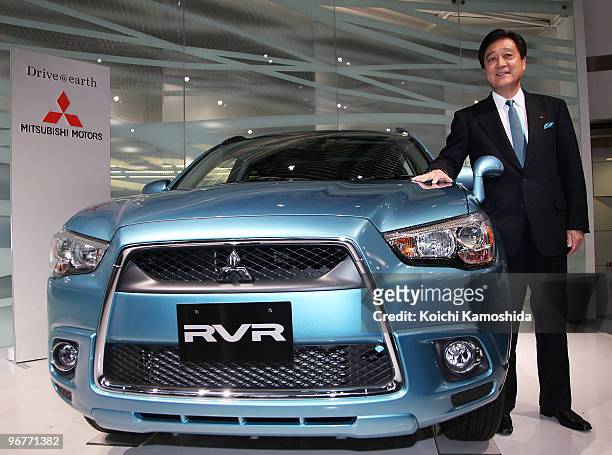 Mitsubishi Motors Corporation President Osamu Masuko introduces their new compact SUV "RVR" at their headquarters on February 17, 2010 in Tokyo,...