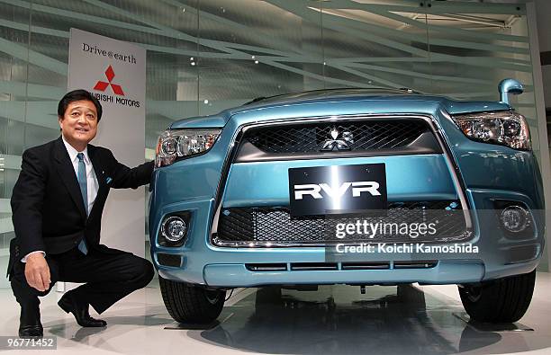 Mitsubishi Motors Corporation President Osamu Masuko introduces their new compact SUV "RVR" at their headquarters on February 17, 2010 in Tokyo,...