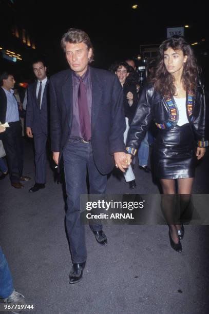 Johnny Hallyday et Adeline Blondieau lors d'une soirée au Fouquet's à Paris le 24 octobre 1989, France.