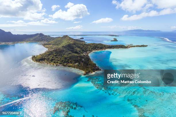 aerial view of the island of bora bora, french polynesia - mt otemanu stockfoto's en -beelden
