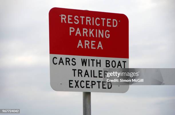 restricted parking area sign stating 'cars with boat trailer excepted' - kiama stock-fotos und bilder