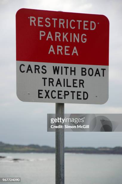 restricted parking area sign stating 'cars with boat trailer excepted' - kiama australia stock pictures, royalty-free photos & images