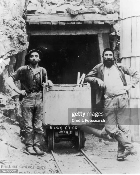 Photograph of Two Gold Miners Standing Outside of the Last Chance Mine, Wearing Levi Jeans in Placer County, California circa 1882.