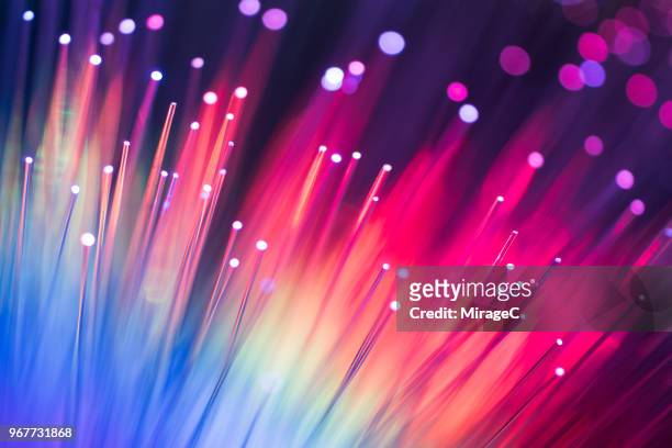 rainbow colored abstract fiber optics - fiber imagens e fotografias de stock
