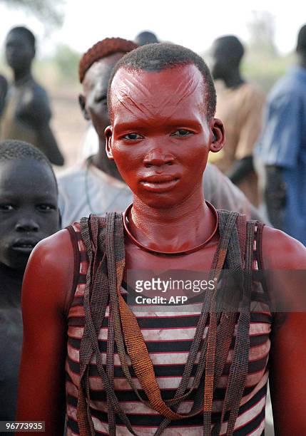 Southern Sudanese dancer from the Mundari ethnic group is pictured during a welcoming ceremony for former US president Jimmy Carter in the Central...