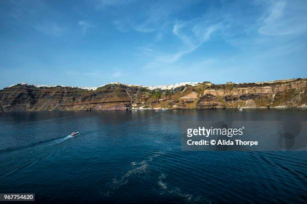 santorini in the distance - alvida stock pictures, royalty-free photos & images
