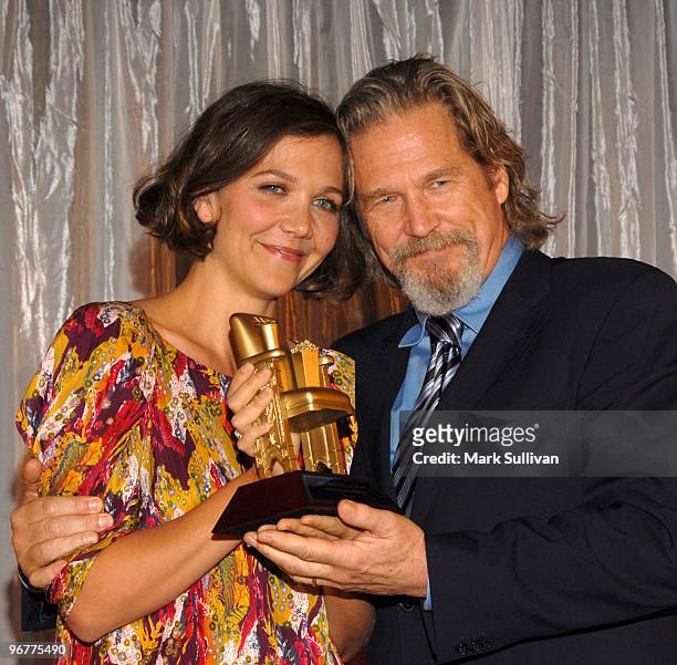 Actress Maggie Gyllenhaal presents the best actor award to actor Jeff Bridges at AARP's 9th Annual Movies For Grownups awards gala held on february...