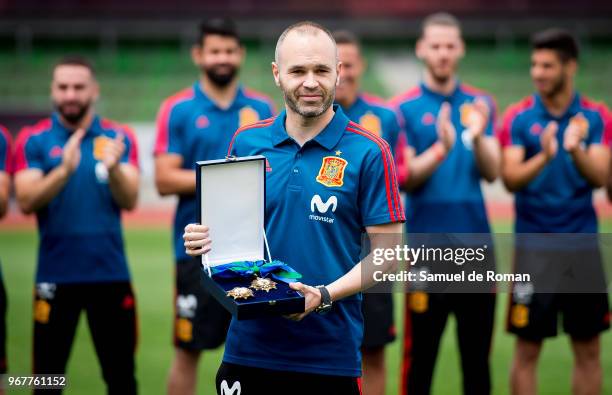 Andres Iniesta shows his award for Spanish sports 'Order of Merit' on June 5, 2018 in Las Rozas, Spain.