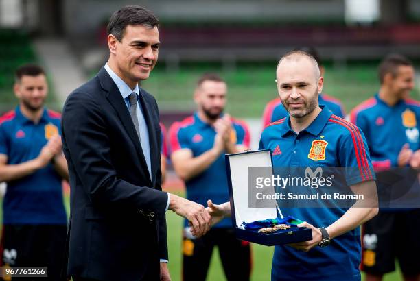 Spanish Prime Minister Pedro Sanchez gives the distinction of 'Order of Merit' for sports to Andres Iniesta during his visit to Spain's national...