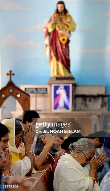 An Indian Catholic Christians offer prayers during an Ash Wednesday service at Saint Mary's Church in Secunderabad on February 17, 2010. Christians...