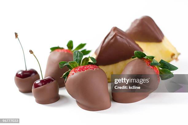 chocolate clad fruits - chocolate dipped stock pictures, royalty-free photos & images