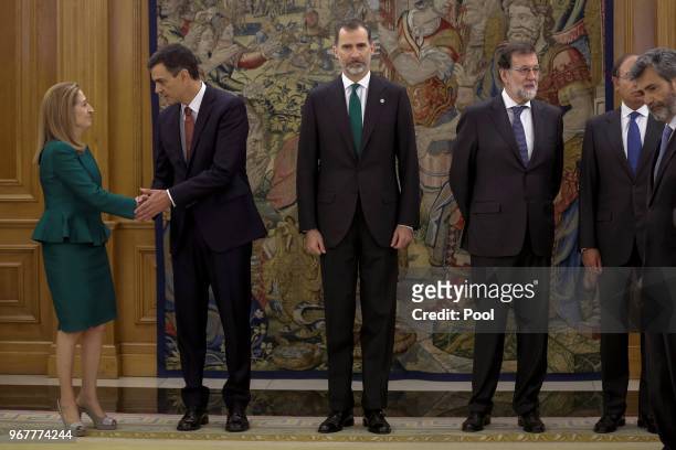 President of the Congress of Deputies Ana Pastor shakes hands with Spain's new Prime Minister Pedro Sanchez as King Felipe VI of Spain and Former...