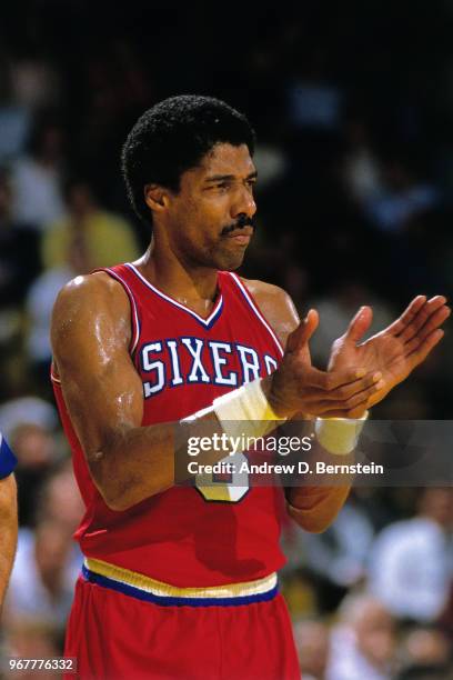 Julius Erving of the Philadelphia 76ers reacts to a play during the game against the Los Angeles Lakers on January 31, 1986 at The Forum in...