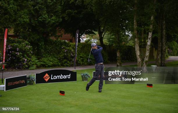 Shane Owen of Cold Ashby Golf Club plays his first shot on the 1st tee during The Lombard Trophy Midland Qualifier at Little Aston Golf Club on June...