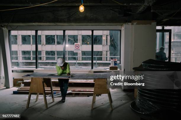 Contractor views blue prints during renovations of the Bank of America Plaza building, the former Biltmore Hotel, at 335 Madison Avenue in New York,...