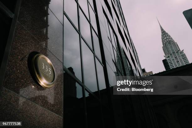 The Bank of America Plaza building, the former Biltmore Hotel, stands in front of the Chrysler building at 335 Madison Avenue in New York, U.S., on...