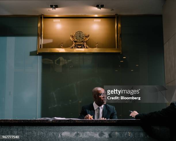 The gilded Biltmore Hotel clock sits above the security desk at the Bank of America Plaza building, the former location of the hotel, at 335 Madison...