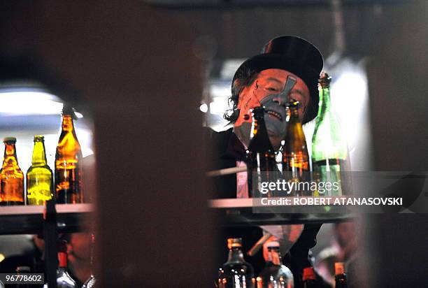 Man plays with bottles during a carnival parade on the streets of Strumica in the great evening carnival, late on February 16, 2010. The renown...