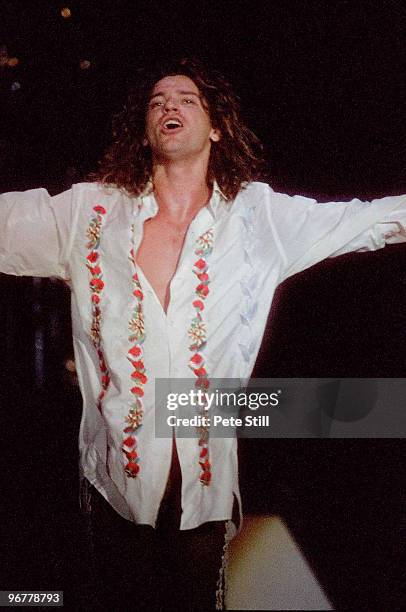 Michael Hutchence of INXS performs on stage on the 'Kick' tour at Wembley Arena on June 24th, 1988 in London, United Kingdom.
