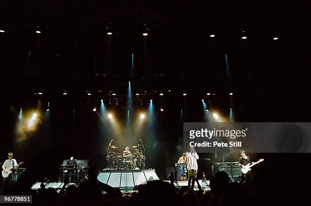Kirk Pengilly, Andrew Farriss, Jon Farriss, Tim Farriss, Michael Hutchence and Garry Beers of INXS perform on stage on their 'Kick' tour at Wembley...