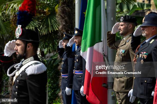 An Italian flag is displayed between different military officers during the celebrations of the Italian National Day on June 02, 2018 in Milan,...