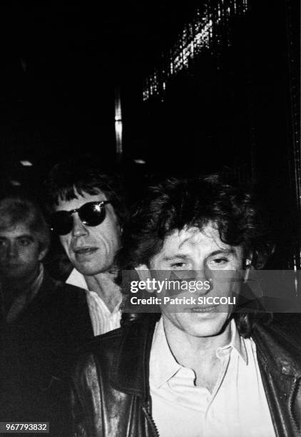 Mick Jagger et Roman Polanski lors d'une soirée sportive comprenant un match de catch féminin catch à Paris le 15 novembre 1982, France.