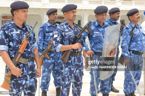 Indian Rapid Action Force personnel stand guard on the eve of the 34th Operation Blue Star anniversary outside the Sikh Shrine Golden temple in...