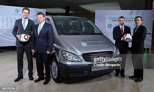 Oliver Bierhoff, team manager of the German football national team, poses with category 'school' first prize winners Hermann Staedtler, Karsten...