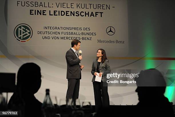 Presenter Asli Sevindim and Oliver Bierhoff, team manager of the German football national team, attend the DFB Integration Award 2009 ceremony at...