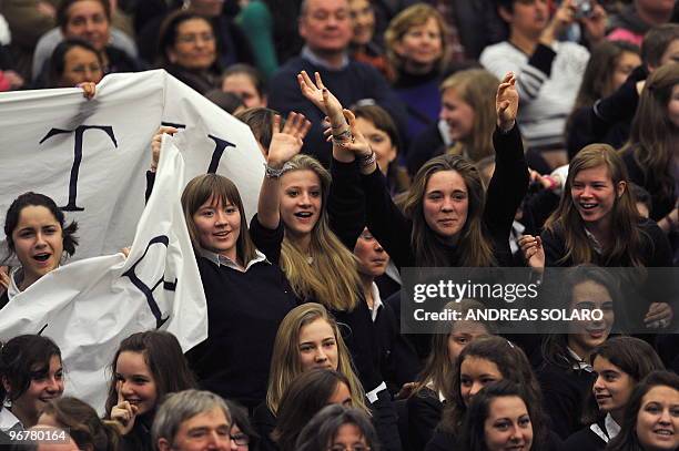 Faithful wave to Pope Benedict XVI during his weekly general audience on February 17, 2010 at Paul VI hall at The Vatican. AFP PHOTO / ANDREAS SOLARO