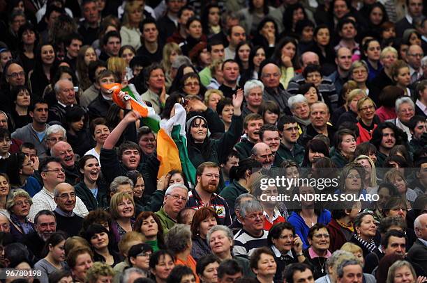 Faithful wave to Pope Benedict XVI during his weekly general audience on February 17, 2010 at Paul VI hall at The Vatican. AFP PHOTO / ANDREAS SOLARO