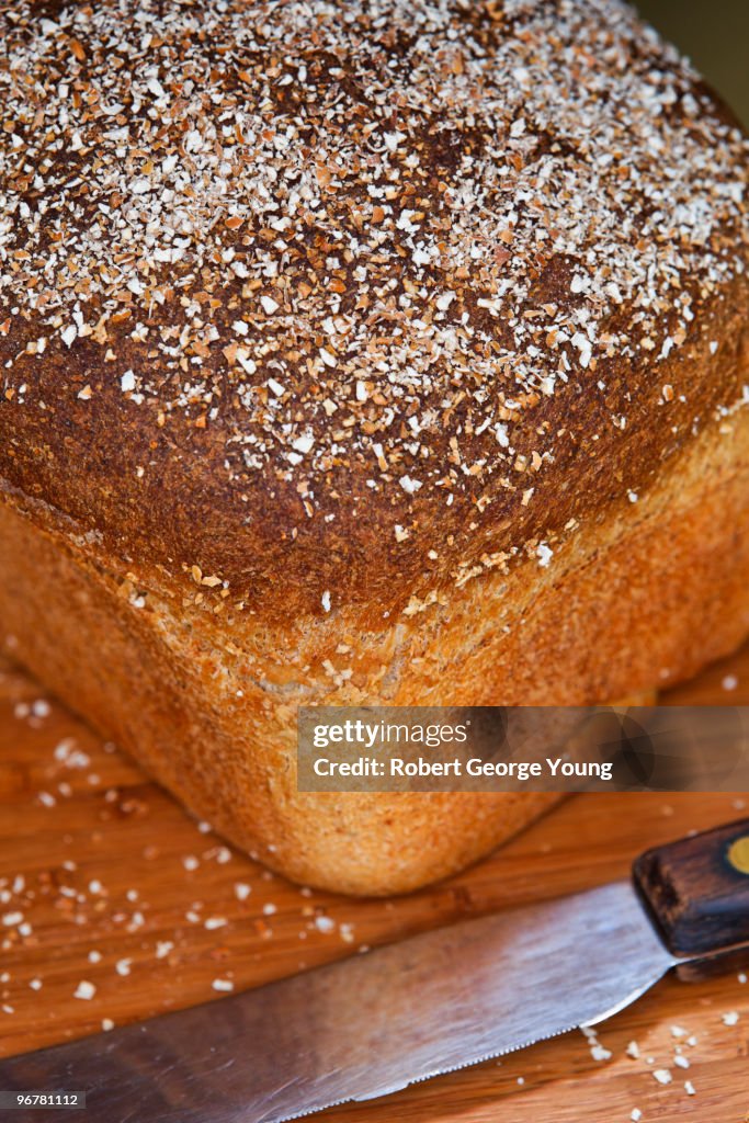 Home Made Bread and Bread Knife on Cutting Board