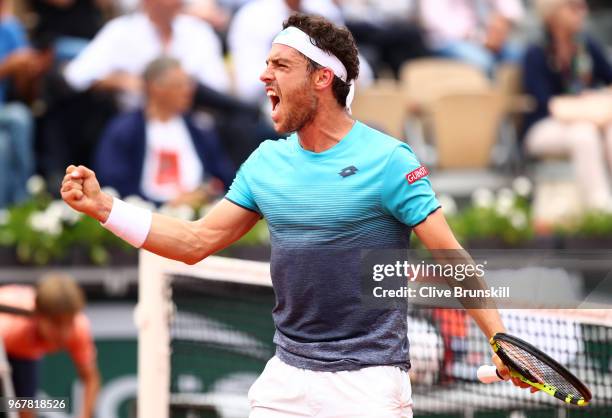 Marco Cecchinato of Italy celebrates winning the second set during the mens singles quarter finals match against Novak Djokovic of Serbia during day...