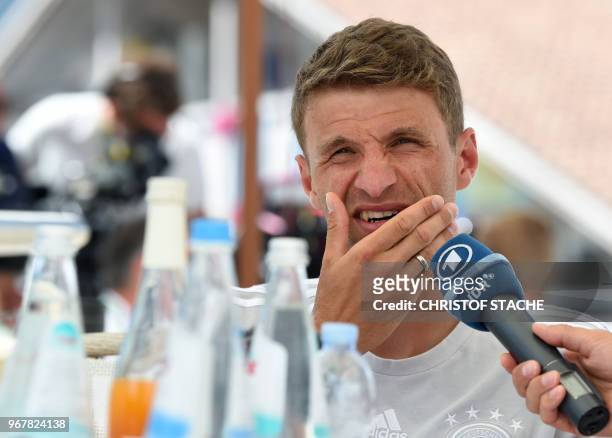 Germany's forward Thomas Mueller speaks with journalists during a so-called media day in the team hotel on June 5, 2018 in Girlan, near Bolzano,...