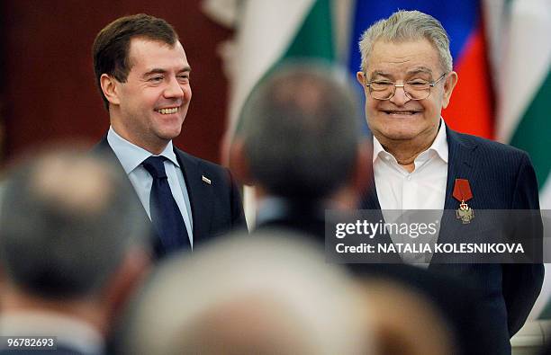 Russian President Dmitry Medvedev smiles with Abkhazian author Fazil Iskander during a meeting at the Kremlin in Moscow on February 17, 2010....