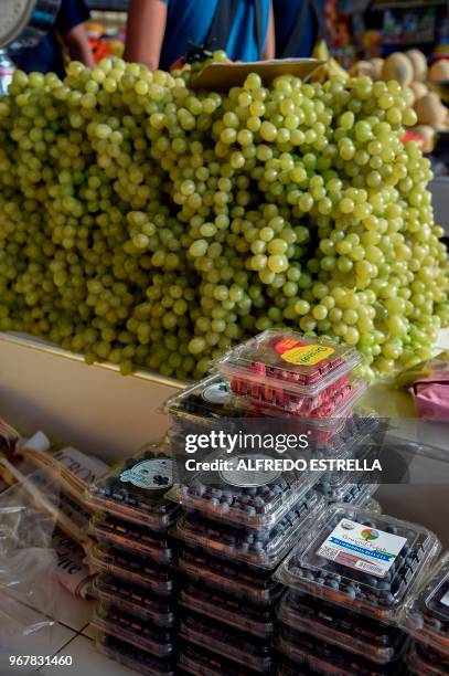 Grapes and blueberries imported from the US, are displayed at the Beethoven market in Peralvillo neighbourhood, Mexico City on June 5, 2018. - The...