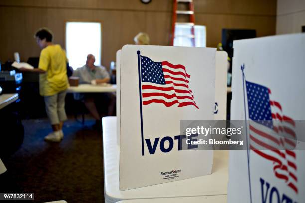 Voter privacy screens sit on tables at a polling location in Davenport, Iowa, U.S., on Tuesday, June 5, 2018. Even as Donald Trump tweets his support...